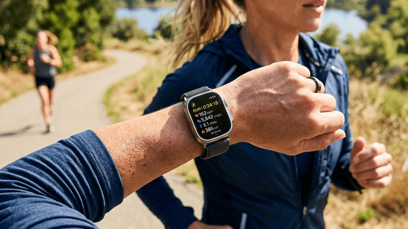 Modern smartwatch displaying health metrics on a wrist during exercise